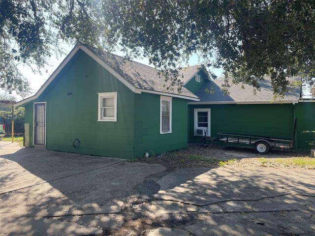 745 Yorkshire St, Houston, TX 77022 - view of property exterior with roof with shingles