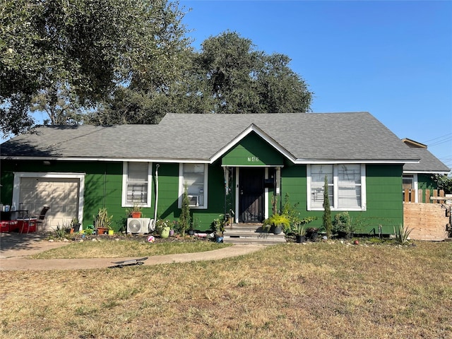 745 Yorkshire St, Houston, TX 77022 - view of front facade featuring a garage, a front lawn, a shingled roof, and a cooling unit