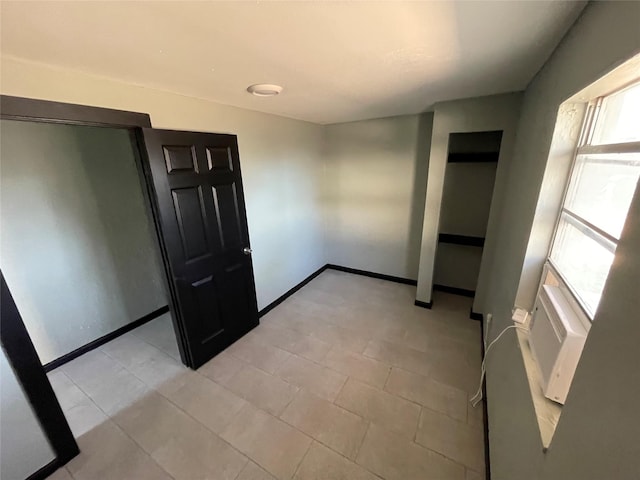 745 Yorkshire St, Houston, TX 77022 - empty room with baseboards and a wall mounted AC