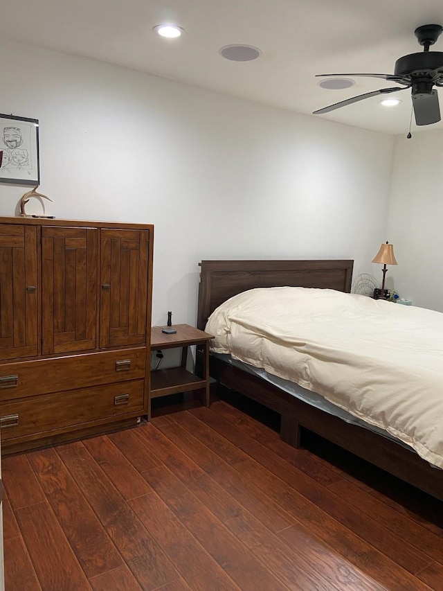 195 Rim Rock Rd, Onalaska, TX 77360 - bedroom featuring dark wood-style flooring, a ceiling fan, and recessed lighting