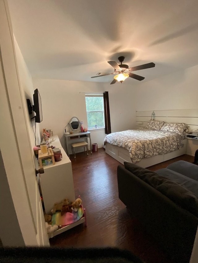 195 Rim Rock Rd, Onalaska, TX 77360 - bedroom with dark wood-style floors and a ceiling fan