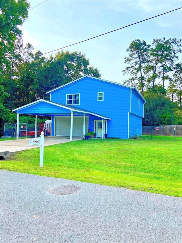 195 Rim Rock Rd, Onalaska, TX 77360 - view of front of property featuring driveway and a carport