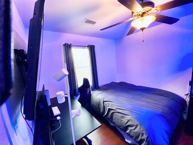195 Rim Rock Rd, Onalaska, TX 77360 - bedroom with wood finished floors and a ceiling fan