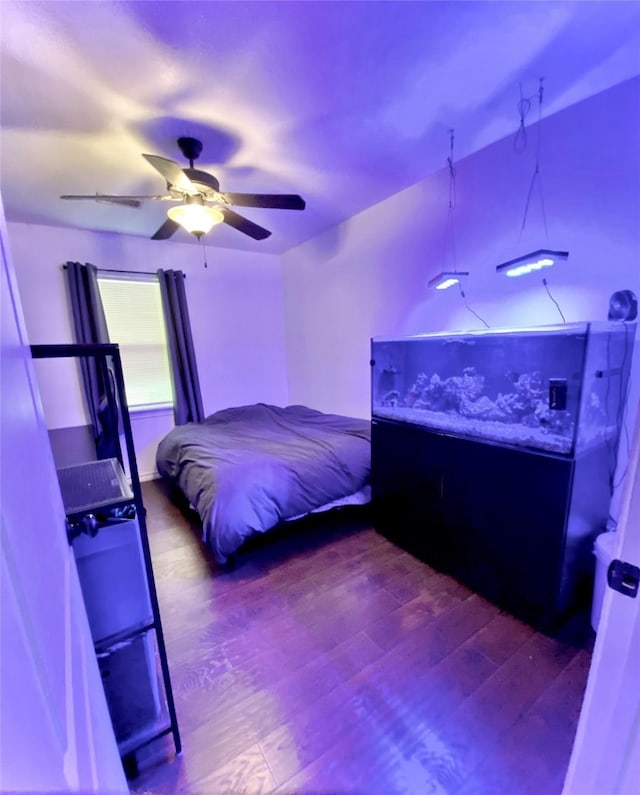 195 Rim Rock Rd, Onalaska, TX 77360 - bedroom featuring wood finished floors and ceiling fan