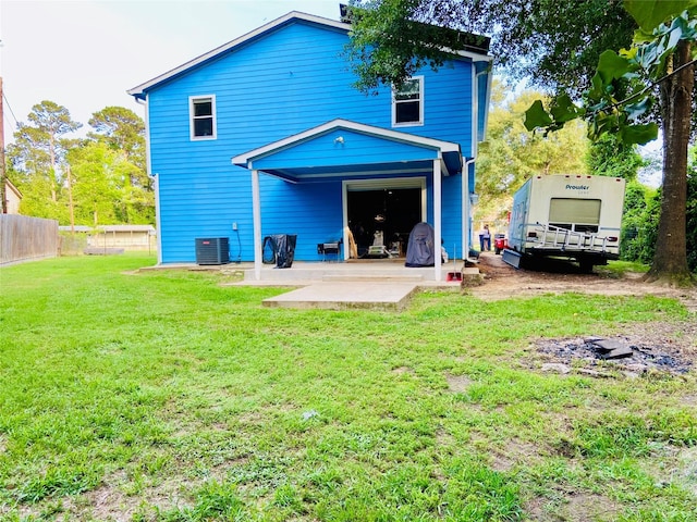 195 Rim Rock Rd, Onalaska, TX 77360 - rear view of house with a patio and cooling unit