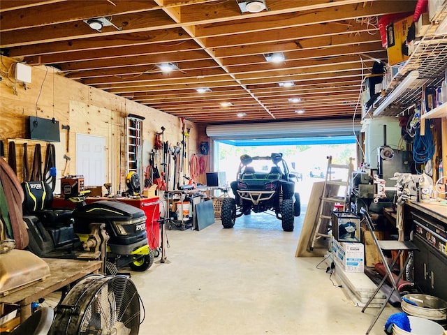195 Rim Rock Rd, Onalaska, TX 77360 - garage featuring a workshop area