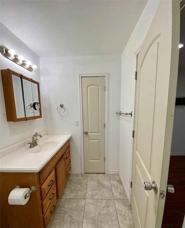 195 Rim Rock Rd, Onalaska, TX 77360 - bathroom with vanity and baseboards