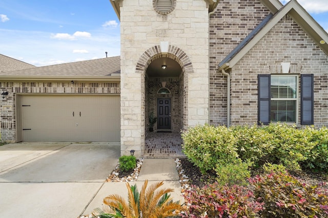 310 Polar Bear Trl, Crosby, TX 77532 - view of front of home featuring brick siding, an attached garage, concrete driveway, and a shingled roof