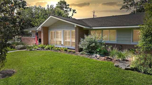 7222 Hartland Ave, Houston, TX 77055 - ranch-style home featuring a front yard, brick siding, and roof with shingles