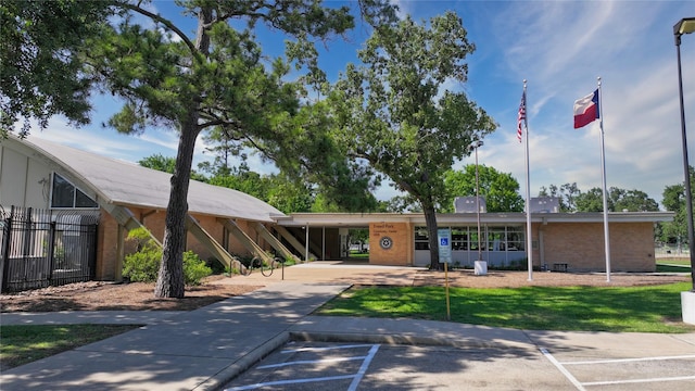 7222 Hartland Ave, Houston, TX 77055 - view of property featuring an attached carport, concrete driveway, and fence