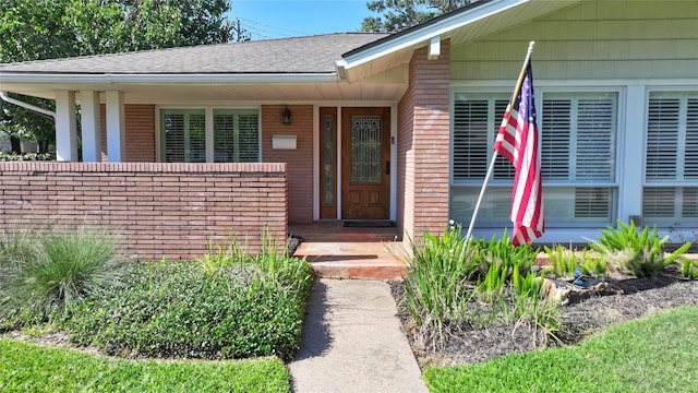 7222 Hartland Ave, Houston, TX 77055 - entrance to property featuring a shingled roof and brick siding