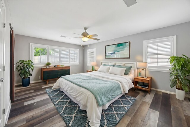 7222 Hartland Ave, Houston, TX 77055 - bedroom with baseboards, wood finished floors, and ceiling fan