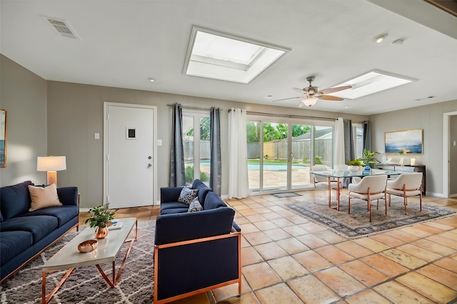 7222 Hartland Ave, Houston, TX 77055 - living area with a skylight, ceiling fan, and baseboards