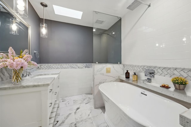 7222 Hartland Ave, Houston, TX 77055 - bathroom featuring tile walls, a skylight, marble look tiles, a soaking tub, and a shower
