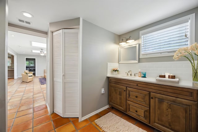 7222 Hartland Ave, Houston, TX 77055 - bathroom featuring a closet, tasteful backsplash, tile patterned floors, vanity, and recessed lighting