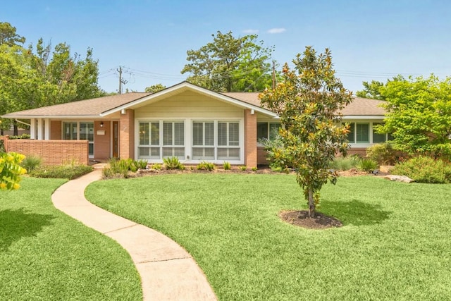 7222 Hartland Ave, Houston, TX 77055 - ranch-style home featuring a front lawn, brick siding, and a shingled roof