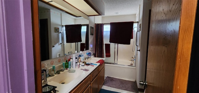 15459 Runswick Dr, Houston, TX 77062 - full bath with a textured ceiling, enclosed tub / shower combo, and double vanity