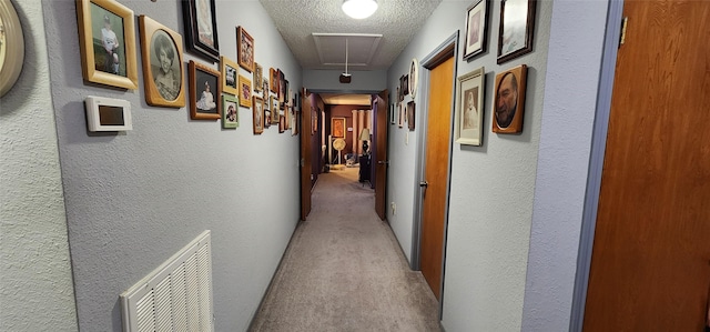 15459 Runswick Dr, Houston, TX 77062 - corridor featuring attic access, carpet flooring, a textured wall, and a textured ceiling