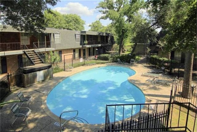 9005 Gaylord St Unit 20, Houston, TX 77024 - community pool with stairs and a patio area
