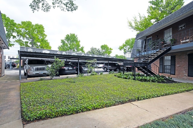 9005 Gaylord St Unit 20, Houston, TX 77024 - covered parking lot featuring stairway