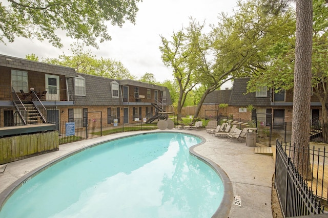 9005 Gaylord St Unit 20, Houston, TX 77024 - community pool featuring stairs and a patio area