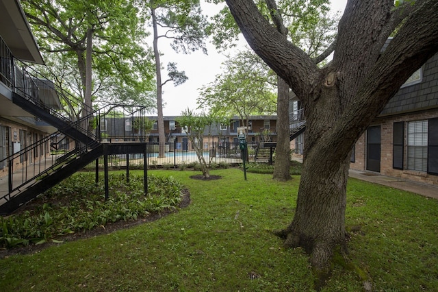 9005 Gaylord St Unit 20, Houston, TX 77024 - view of yard featuring stairs and a community pool
