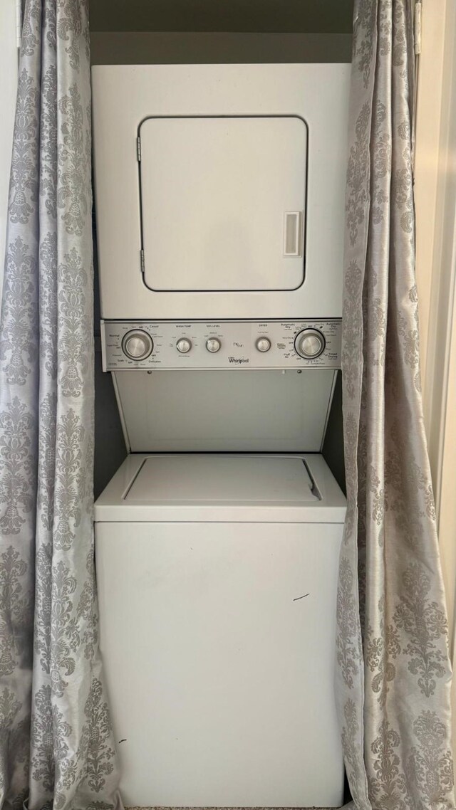 9005 Gaylord St Unit 20, Houston, TX 77024 - laundry room featuring estacked washer and dryer