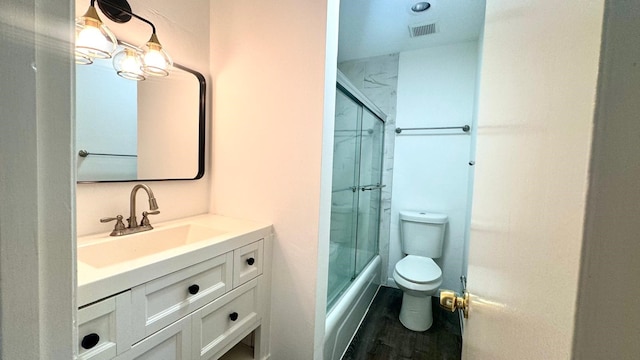9005 Gaylord St Unit 20, Houston, TX 77024 - full bathroom with vanity, combined bath / shower with glass door, and wood finished floors