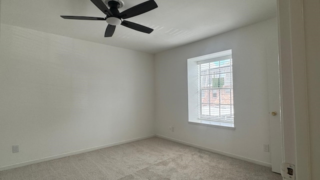 9005 Gaylord St Unit 20, Houston, TX 77024 - empty room featuring light colored carpet and a ceiling fan