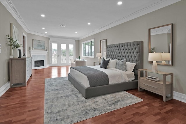 bedroom featuring crown molding, baseboards, recessed lighting, a high end fireplace, and access to exterior