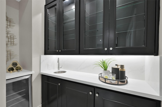 indoor wet bar featuring wine cooler