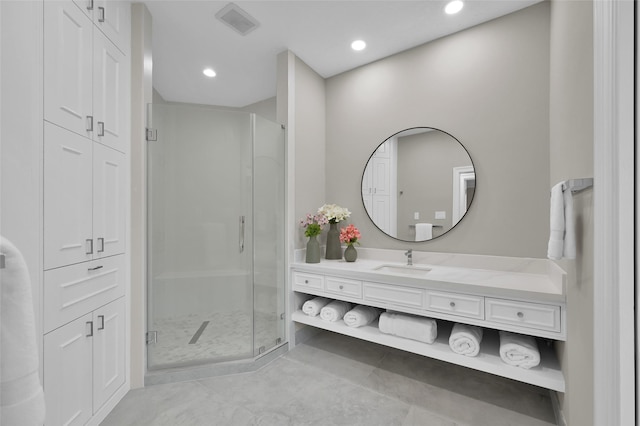 bathroom featuring a shower stall, tile patterned floors, vanity, and recessed lighting