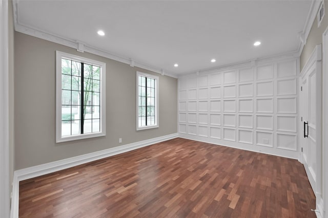 unfurnished room with crown molding, dark wood finished floors, baseboards, and recessed lighting