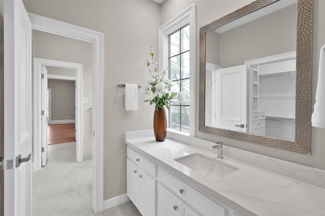 bathroom featuring vanity and baseboards