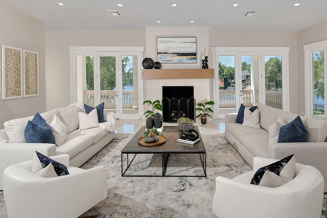 living area featuring recessed lighting and a fireplace