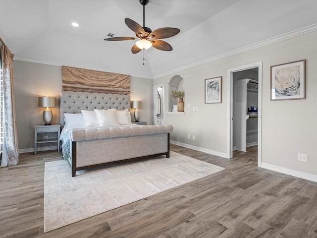441 Jeanie Lynn St, Galveston, TX 77554 - bedroom featuring a spacious closet, baseboards, wood finished floors, crown molding, and recessed lighting