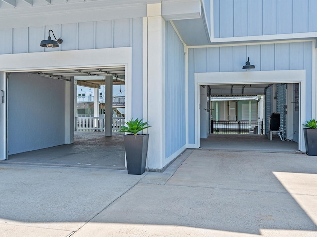 441 Jeanie Lynn St, Galveston, TX 77554 - view of exterior entry featuring driveway and a garage
