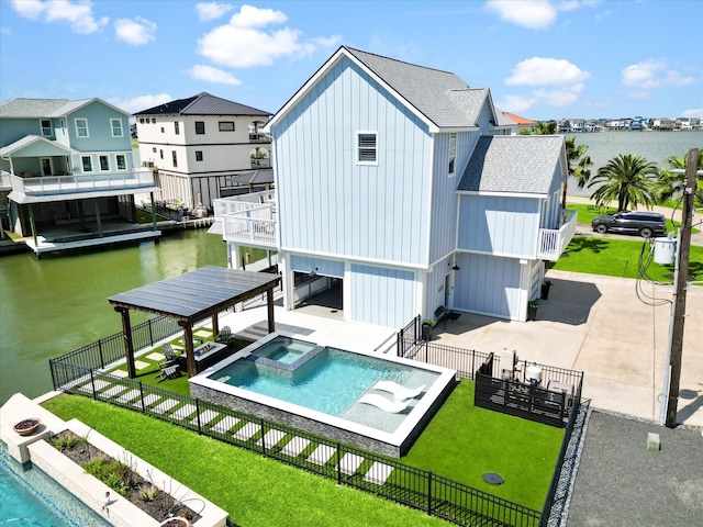 441 Jeanie Lynn St, Galveston, TX 77554 - rear view of property featuring an in-ground hot tub, a patio, board and batten siding, roof with shingles, and a water view