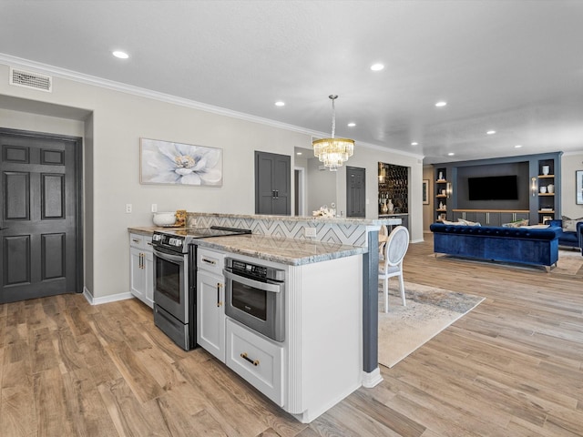 441 Jeanie Lynn St, Galveston, TX 77554 - kitchen featuring stainless steel appliances, a chandelier, a breakfast bar area, ornamental molding, and light wood finished floors