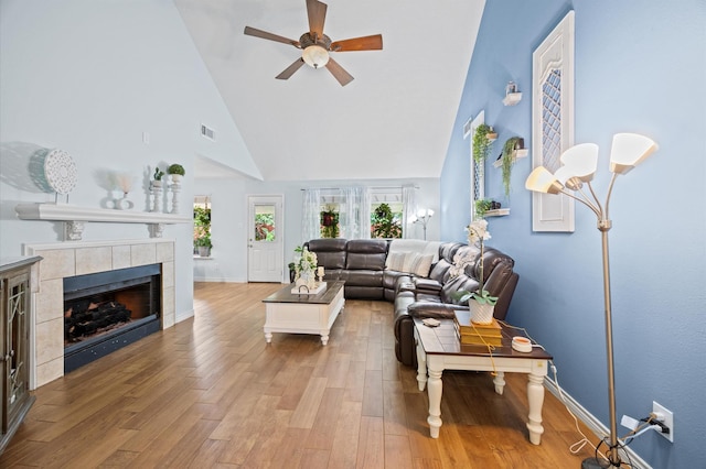 9519 Territory Ln, Houston, TX 77064 - living room featuring high vaulted ceiling, ceiling fan, light wood finished floors, and plenty of natural light