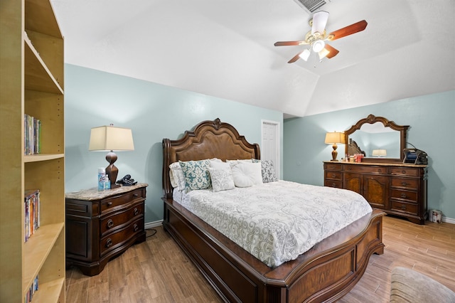 9519 Territory Ln, Houston, TX 77064 - bedroom featuring light wood finished floors, vaulted ceiling, ceiling fan, and baseboards