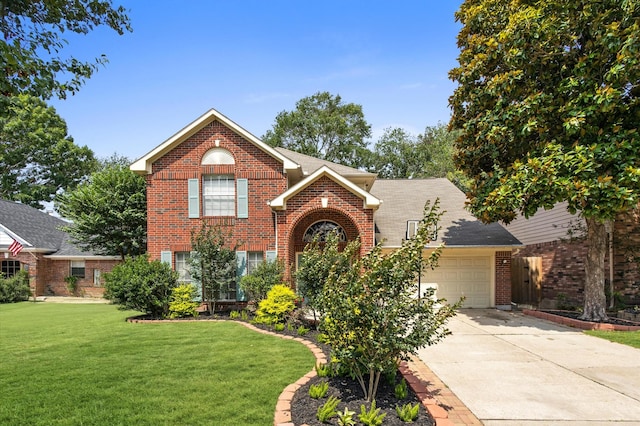 9519 Territory Ln, Houston, TX 77064 - traditional home with brick siding, a garage, driveway, a front yard, and a shingled roof