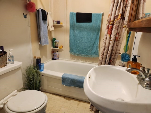 3406 N Winfree, Dayton, TX 77535 - bathroom with a sink, a tub, toilet, and tile patterned floors