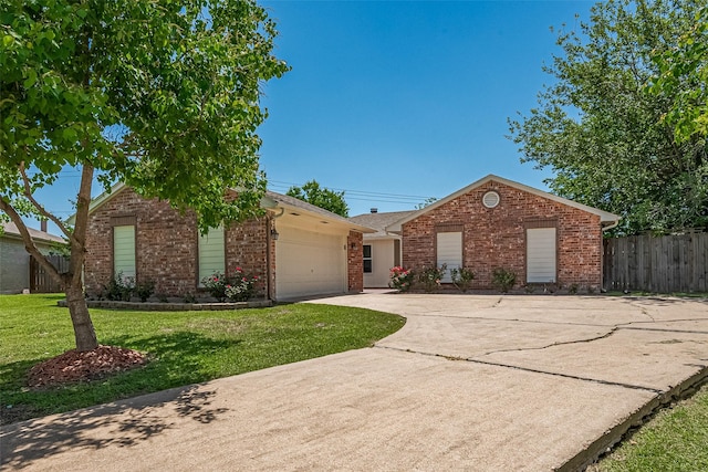 12703 Fenimore Ct, Sugar Land, TX 77478 - view of front of home featuring brick siding, a garage, and driveway