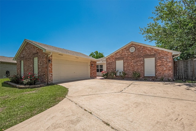 12703 Fenimore Ct, Sugar Land, TX 77478 - ranch-style house with brick siding, a garage, concrete driveway, and roof with shingles