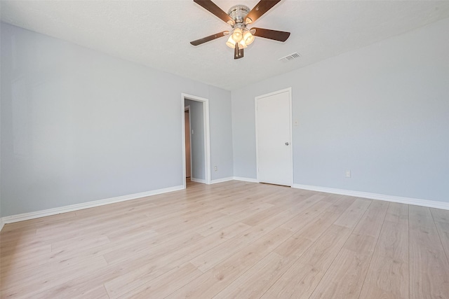 12703 Fenimore Ct, Sugar Land, TX 77478 - spare room featuring light wood-style flooring, a ceiling fan, and baseboards
