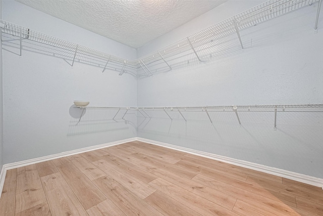 12703 Fenimore Ct, Sugar Land, TX 77478 - walk in closet featuring light wood-style floors