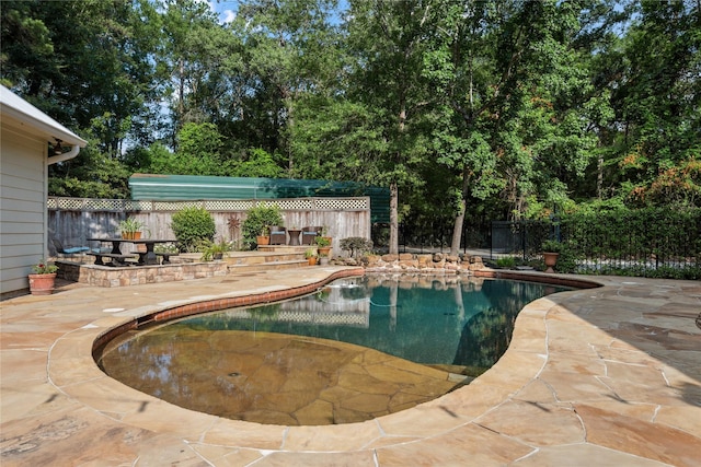 30011 Commons Forest Ct, Huffman, TX 77336 - view of pool with a patio, a fenced backyard, and view of scattered trees