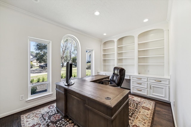 2203 Long Valley Dr, Kingwood, TX 77345 - office space featuring a textured ceiling, ornamental molding, built in shelves, dark wood finished floors, and recessed lighting