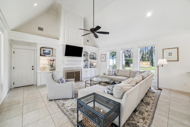 2203 Long Valley Dr, Kingwood, TX 77345 - living room with a ceiling fan, high vaulted ceiling, light tile patterned floors, a fireplace with flush hearth, and built in shelves
